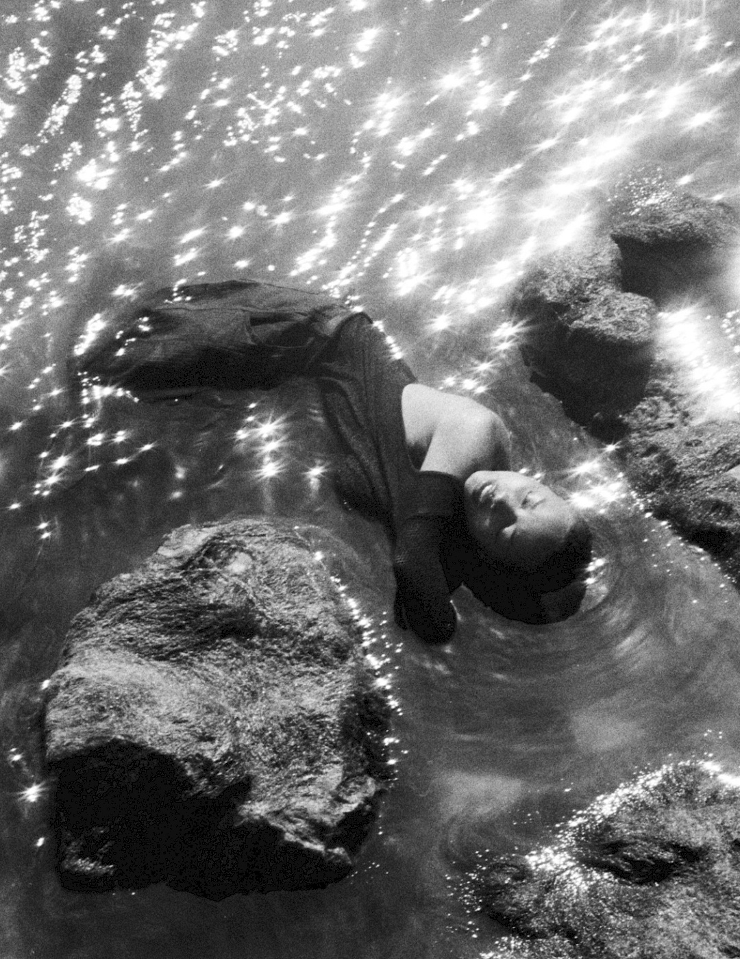 Black-and-white image by feeo of cliffs in sparkling water